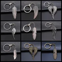 12 Options Nouvelles hommes de mode 30 mm Keychain DIY Metal Halder Chaîne Vintage Ailes Plume Pendre Course Souveniture Cadeau