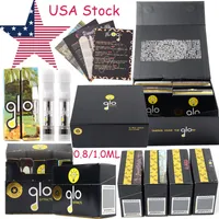 Lager i USA Glo Tropical Vacation Ddition Atomizers Vape Carthges Black Gold Packaging Wax Waporizers Cartridge E Cigaretter 510 Tråd tom