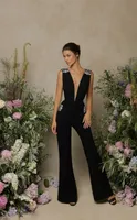 Sexig mantel Deep V Neck Black Jumpsuit Prom Dresses Backless Beadings Golvlängd Festklänning