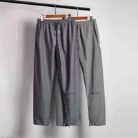 Pantalones para hombres excelente diseñador estilo universitario para hombres y mujeres deportes hip hop hop esencial de nylon láser color reflectante mujeres9S9
