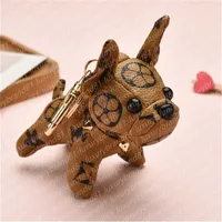 Keychains de designer de luxo Design de marca de cachorro Pingente Keys Chains Bag Pingente Pingerboard Creative Leather Dogs Universal Five Flor Key