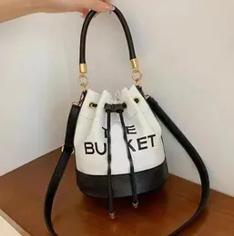 DHgate.com:Embossed Drawstring Bucket Bag - Womens Designer