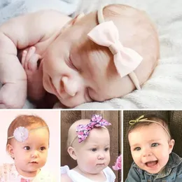 ヘアアクセサリー3pcs/lot girls baby headbands bowsフラワーエラスティックナイロンポグラフィングプロップ