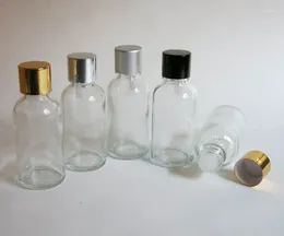 Bottiglie di stoccaggio 100 pezzi Bottiglia di vetro trasparente da 30 ml all'ingrosso con contagocce riduttore e coperchio antimanomissione a vite sull'olio essenziale