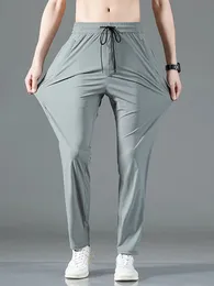 Pantaloni sportivi da uomo con tasche estive con zip Pantaloni sportivi dritti di grandi dimensioni in nylon elasticizzato ad asciugatura rapida 8XL 240103