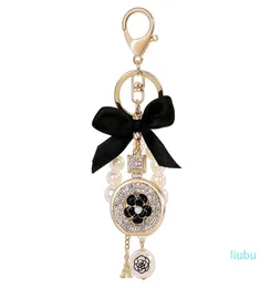 Lovely cute bow pearl flower perfume bottle keychains new fashion ins luxury designer diamond rhinestone bag charm7768350