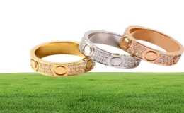 Stilista di moda classico anello per unghie per donna uomo pieno di cristallo Cz acciaio inossidabile amore lusso oro 18 carati anelli a vite matrimonio E7533072