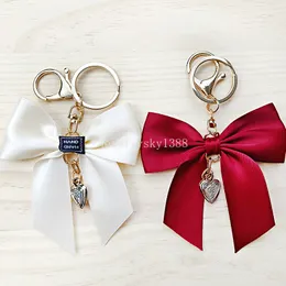 Süße große Schlüsselanhänger mit Schleife für Damen, einfarbig, imitiert Seidenband, Schlüsselanhänger, Autoschlüsselhalter, Taschen, hängende Ornamente