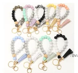 FedEx 9 Colors Wooden Tassel Party Favore Bead Bead String Bracelet Keychain Food Grade Silicone Beads Bracelets Women Girl Keyring Wris5560421