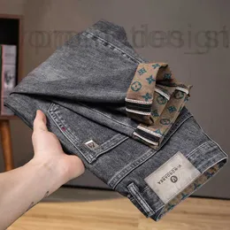 Calças de brim masculinas designer de luxo preto impresso jeans marca na moda masculina 2023 verão nova versão coreana tendência magro encaixe calças de perna pequena para homens l6 jrk4