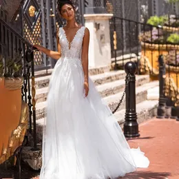 Oszałamiający bride 2024 Princess White Tiulle Lace Appliques Boho Suknie ślubne długie A-line seksowne deski dekoltowe Pearls Beach Bridal Suknie