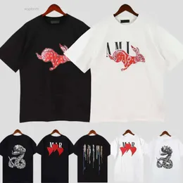 AMRI 2023 MENSWOMENS DESIGNER GRAFFITI T-SHIRTS Tryckt Fashion Man T-shirt Cotton Casual Tees Kort ärm Hip Hop Streetwear 2178