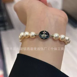 Viviennes Westwoods black enamel buckle pearl bracelet magnetic buckle enamel bracelet sweet cool pearl magnetic suction bracelet