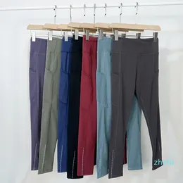 Pantaloni da yoga outfit a doppia faccia a doppia faccia in alto fitness multi-tasca allenamento leggings che corre con spot inverso a nove punti pantaloni da palestra per motociclisti