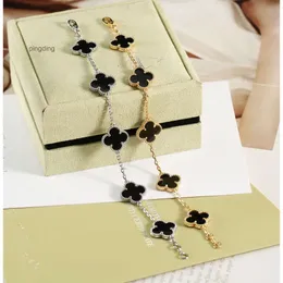 Smyckesdesignerkedja skåpbil fyra blad klöver armband cleef van armband vintage charm koppar med 18k guldpläterad vit keramisk märke blomma för wo