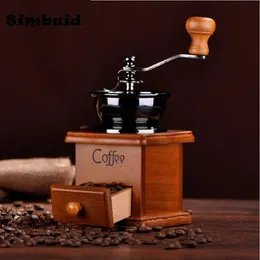 Macinino da caffè manuale classico vintage in legno di Mills. Forma a cassetto del mulino per chicchi di caffè a manovella antica con impostazioni di macinazione