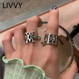 Pierścienie zespołowe Livvy 2022 Nowy mody podwójny V Cross Hollow szeroki pierścień dla kobiet kreatywność Wspaniała palec biżuterii Prezent 240125