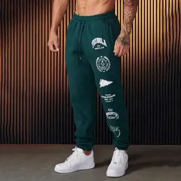 Pantaloni sportivi da uomo Jogger Abbigliamento stile americano Palestra Sport Fitness Pantaloni casual in cotone stampato a vita media con coulisse 240125