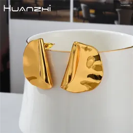 Brincos de garanhão Huanzhi 2024 moda exagerada enrolada cor de ouro metal para mulheres menina luz luxo robusto design criativo jóias