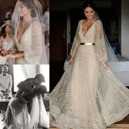 Stunningbride 2024 Boho Champagne Abiti da sposa Scollo a V maniche lunghe Abiti da sposa con paillettes Lunghezza del pavimento Plus Size Abito da sposa bohemien da spiaggia