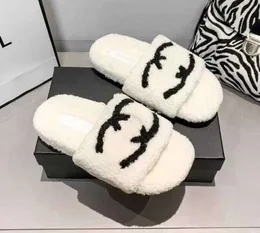 Högkvalitativa tofflor Woolskin Sheepskin Intersy Sole Sandals Flat Slipper Designers Women Soft Winter Luxury Plush Päls Oran Rubber Sole 87