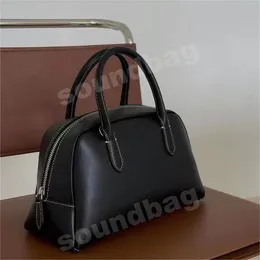 Корейская дизайнерская брендовая сумка Boston, сумка из натуральной кожи, сумка-тоут Минималистская весенне-летняя модная и универсальная высококачественная кожаная дорожная сумка кремового черного цвета.