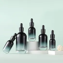 Garrafas de óleo essencial de vidro preto gradiente Cuidado com o gotor de gotas de soro com pipeta 10ml 20ml 30ml 50ml 100ml