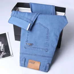 Springsummer cienki jeansowy bawełniany stretch dżinsy Men Business Casual tkanina wysoka talia jedwabne lekkie spodnie 240227