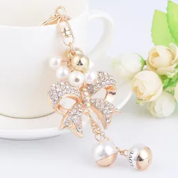 Nova moda ins designer de luxo diamante strass bonito arco pérola saco encantos borla chaveiros branco gold223t