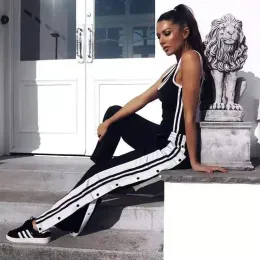 Capris barato mulheres joggers sweatpants casual calças de perna larga feminina listra hip hop calças de suor streetwear feminino botão vintage