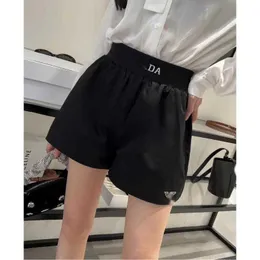 디자이너 PA23SS 새로운 Jacquard Elastic Belt Sports Shorts Classic 삼각형 장식 느슨한 캐주얼 나이를 줄이고 다재다능한 Znig.