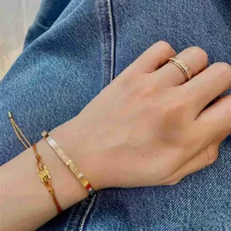Französische Mode, Instagram-Nische, minimalistisches Persönlichkeits-Titanstahl-vergoldetes Triumphbogen-Armband mit gewebtem Kordelzug für Damen