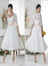 Abiti da sposa bohémien vintage 2019 con applicazioni in pizzo taglie forti con mezze maniche trasparenti 1950039s scollo a V lunghezza tè A Line Beach 6523926