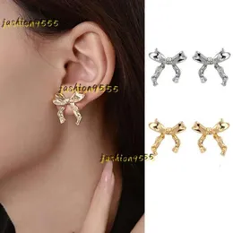 Brincos de garanhão 2024 par mulheres oorbellen ouro bowknot forma orelha studs orecchini bonito piercing arco acessórios designer brincos jóias presente de alta qualidade