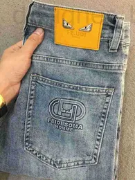 Jeans de designer de luxo masculino bolso aço impresso jeans primavera e outono marca de moda juventude magro ajuste elástico simples personalizado versátil calças cortadas INFJ