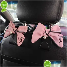 Altri accessori interni Nuovo simpatico diamante Bowknot Sedile posteriore per auto Ganci portaoggetti Poggiatesta per veicolo Organizer Gancio per borsa della spesa In Dha8G