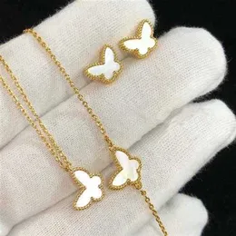 Collana V Versione alta V oro mini quattro foglie erba bianca conchiglia farfalla collana femminile orecchini con bracciale turchese in oro rosa