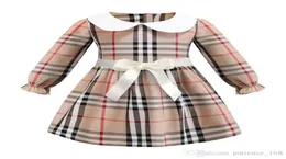 Kariertes Kleid 2019 INS neue Ankunft Frühlingsstile Mädchen Kinderkleid Langarm weißes Puppenkragen hochwertiges Baumwollkleid 2 Farben f1632609