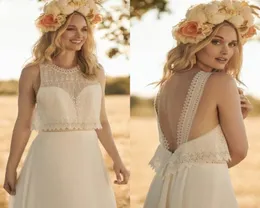 2020 Modest Rembo Styling Bohemian Simple Jewel Sleeveless Backless Wedding Dresses Lace Ruffles Wedding Gowns Sweep Train robe de6216132