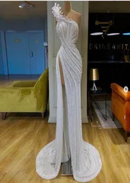 Białe błyszczące cekinowe sukienki na studniówek seksowne wysokie dzielone syrena syrena wieczorowa sukienki Pick Ups Appliques imprezowe suknie afrykańskie Dubai v6195720