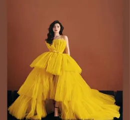 Puffy High Low Yellow Prom Dresses Short Front Long Back Tulle Spaghetti Straps Formella aftonklänningar Tiered Kjol Pageant Special 5588392