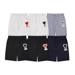 SS New Mi Shorts Big Love Emblem Emblem 자수 패치 남성과 여성 커플 느슨하고 캐주얼 한 다재다능한 스포츠 바지 5/4