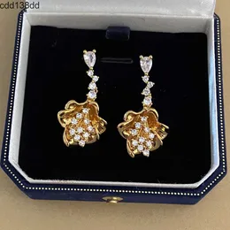 Stud Fashionable and high-end copper plated real gold trumpet flower earrings niche light luxury zircon 925 silver needle earrings