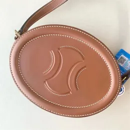 Yeni Üçlü Moda Yuvarlak Çantalar Lüks Çanta Kadınlar Erkekler Düzgün Gerçek Deri Tasarımcı Çantalar Oval Cüzdan Çapraz Vücut Pochette Seyahat Debriyaj Omuz Çantası