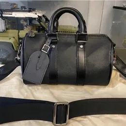 Men's designer cross-body bag in black leather in the shape of a cylinder