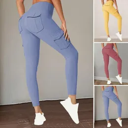 Kvinnors byxor solid färg yoga hög midja mage kontroll med flera fickor för kvinnor stretchiga leggings som kör sport