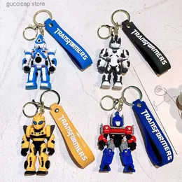 Klapetynki Transformatory Transformatory Działanie Blak Figures Optimus Prime Bumblebee Pendants Anime Car Key Ring Cartoon Doll Plecak Pendant Toys Dift Y240316