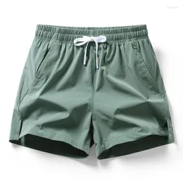 Herr shorts sommar fast färg mode elastisk midja man hög gata casual lösa fickor dragsko ventilera all-match menskläder