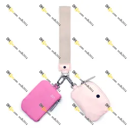 Pulseira de bolsa dupla Carteira de punho de chaveiro rosa para mulheres mini zip em torno da bolsa de moedas Carteira portátil portátil Chave de carteira de carteira Bola de bolsa de moeda Xtdh2014 Bolsa