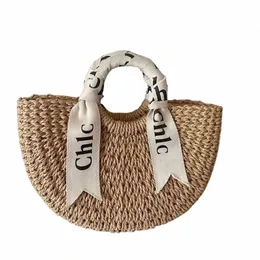 Designer Casual Vacati Borse da spiaggia Spalla Lettera Sciarpa di seta Borsa portatile in paglia intrecciata Versatile semicircolare Borse da donna in rattan Borse da negozio A2nz #